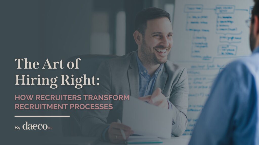 Smiling professional in a suit sitting across a table during a discussion, with a whiteboard featuring diagrams and notes in the background. The text overlay reads: 'The Art of Hiring Right: How Recruiters Transform Recruitment Processes' by DaecoHR.