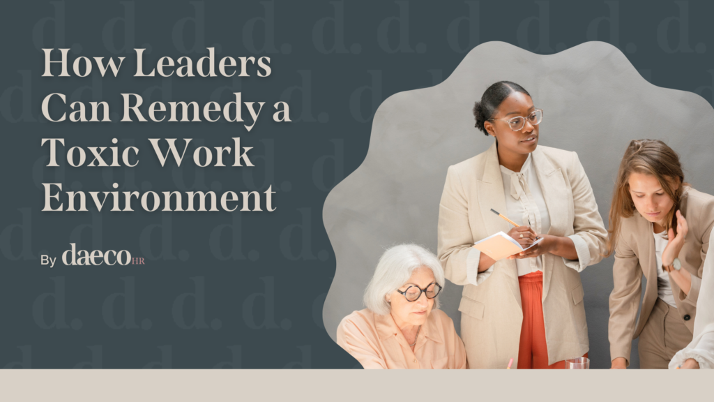Professional women in leadership roles collaborating during a workplace meeting with notepads and documents, representing leadership strategies to address toxic work environments by Daeco HR